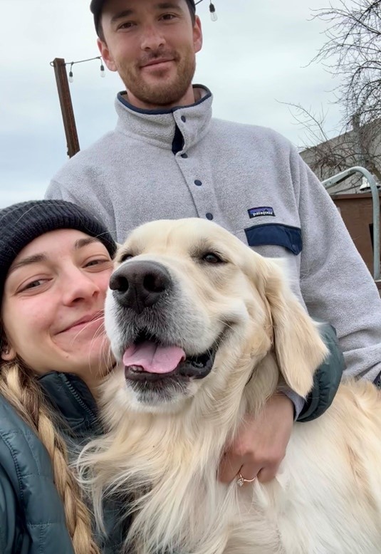 A fun photo of Dr. Bronwyn Butuk, partner and dog