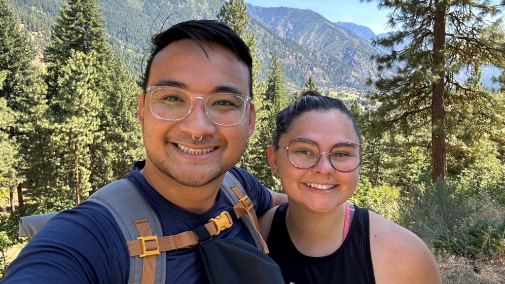 A fun photo of Dr. Celine Tran and partner in the woods.